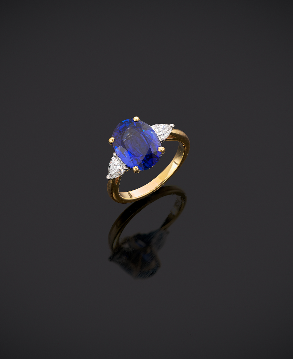 An Impressive 18ct Gold Oval Cut  4.96ct Sapphire And Pear Cut Diamond Three Stone Ring