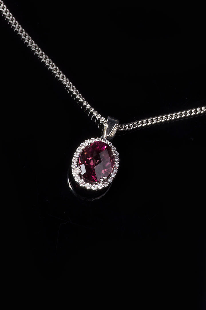 18ct White Gold Pink Tourmaline Pendant with a Diamond Halo