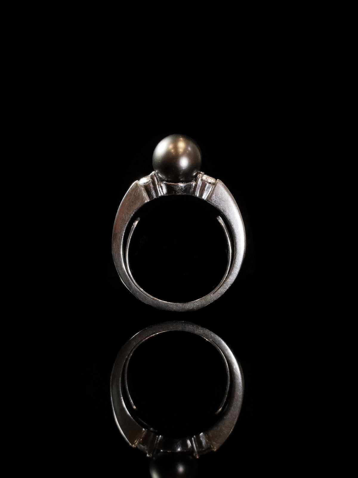 18ct White Gold Diamond and Black Pearl Three Stone Ring