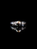 18ct White Gold Diamond and Black Pearl Three Stone Ring