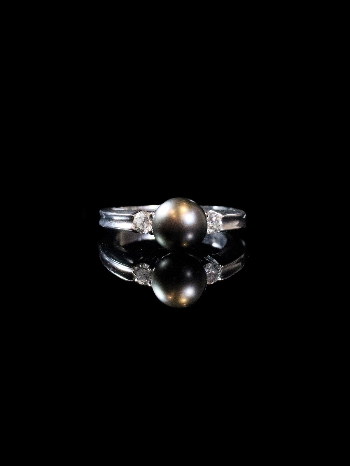 18ct White Gold Diamond and Black Pearl Three Stone Ring
