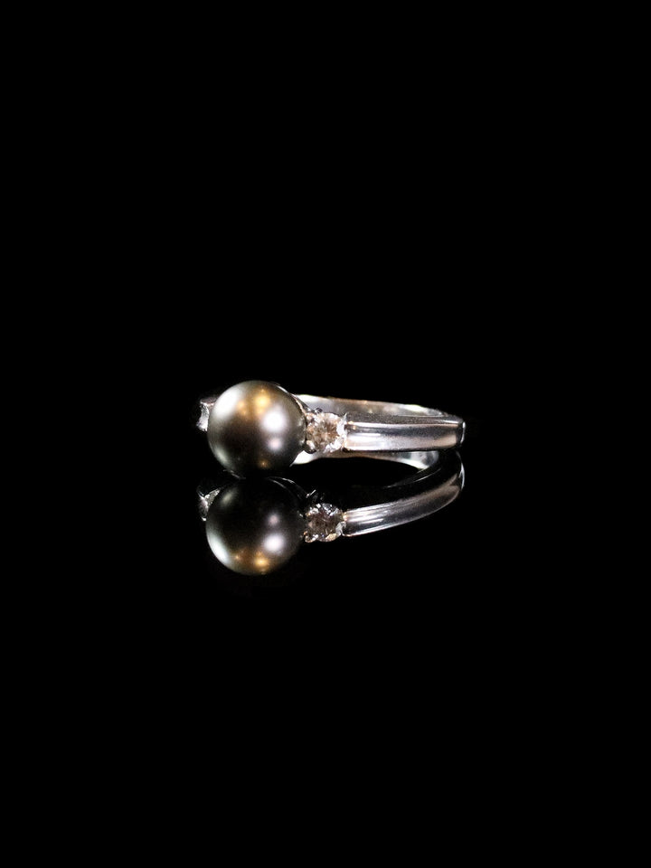 18ct White Gold Diamond and Black Pearl Three Stone Ring