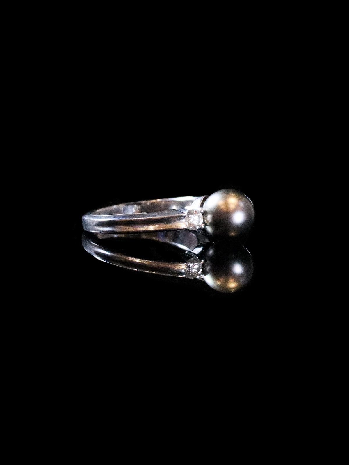 18ct White Gold Diamond and Black Pearl Three Stone Ring