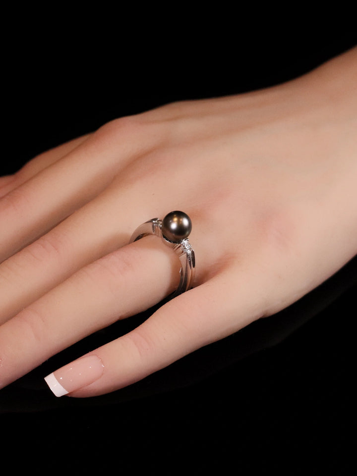 18ct White Gold Diamond and Black Pearl Three Stone Ring