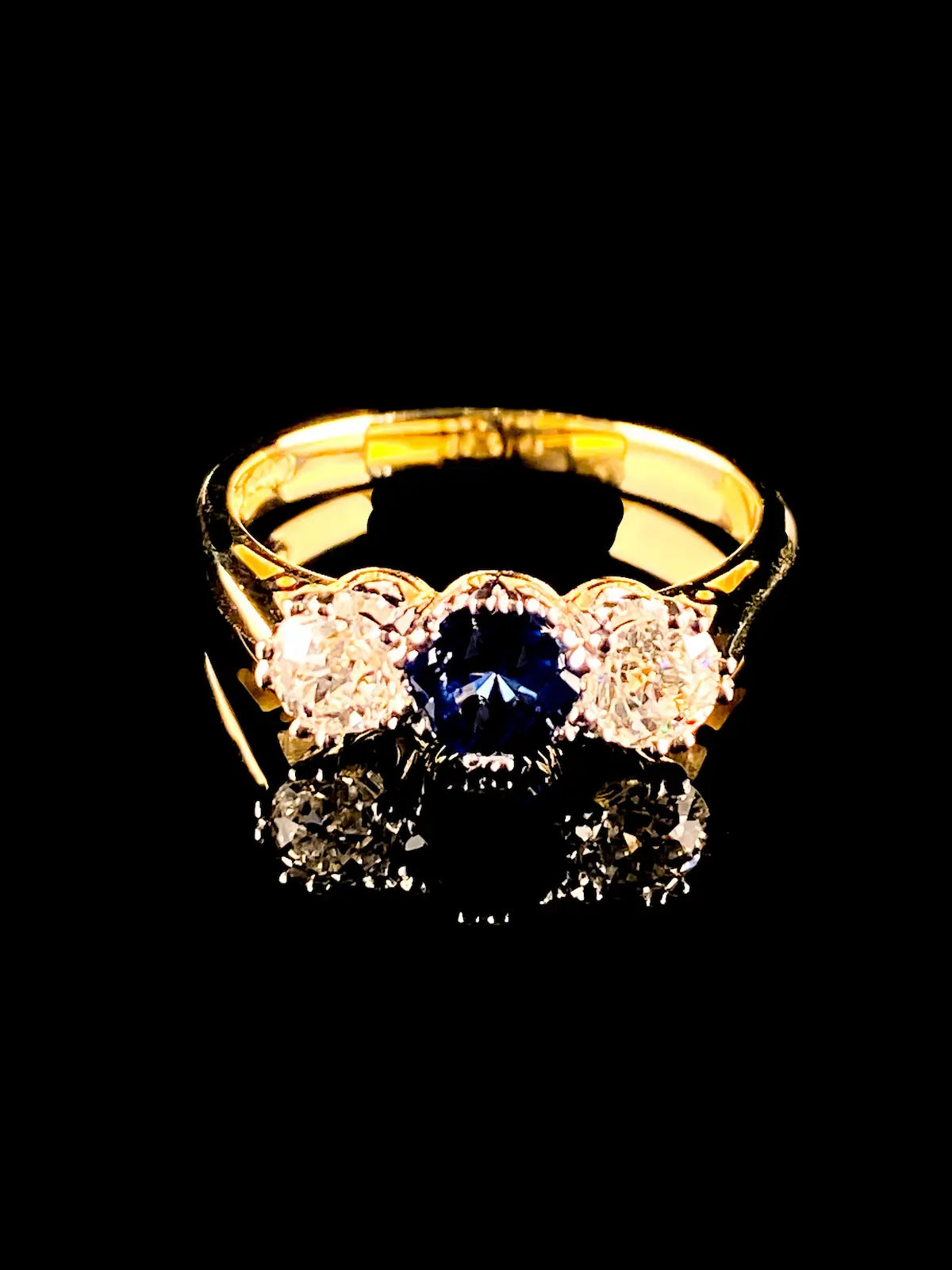 18ct Gold and Platinum 0.56ct Sapphire and Old Cut 0.62ct Diamond Three Stone Ring