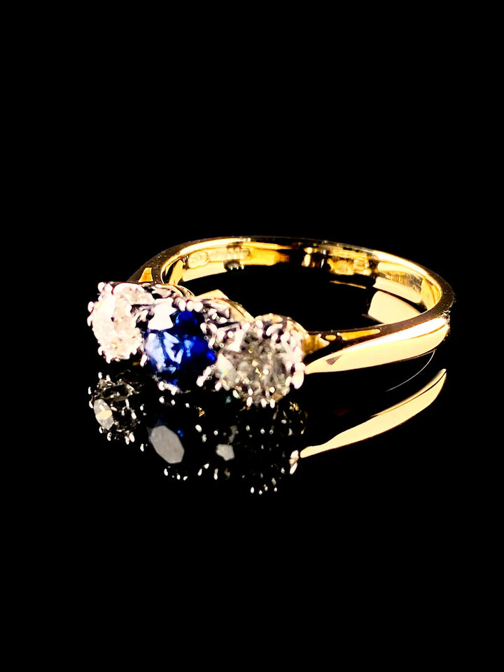 18ct Gold and Platinum 0.56ct Sapphire and Old Cut 0.62ct Diamond Three Stone Ring