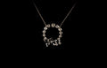 18ct gold circular old cut diamond set pendant with bow design
