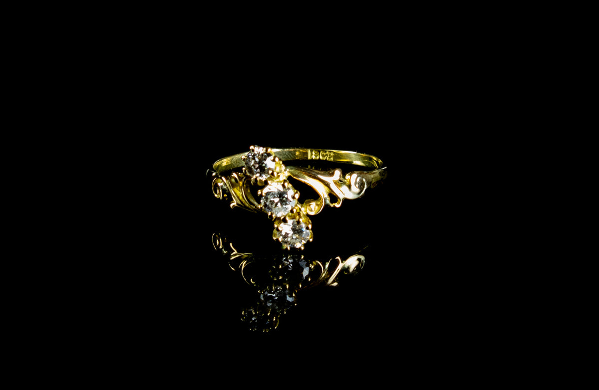 18ct Gold Three Stone 0.60ct Diamond Twist Ring