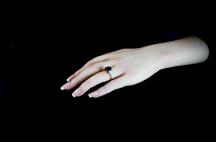 An Impressive 18ct Gold Oval Cut  4.96ct Sapphire And Pear Cut Diamond Three Stone Ring