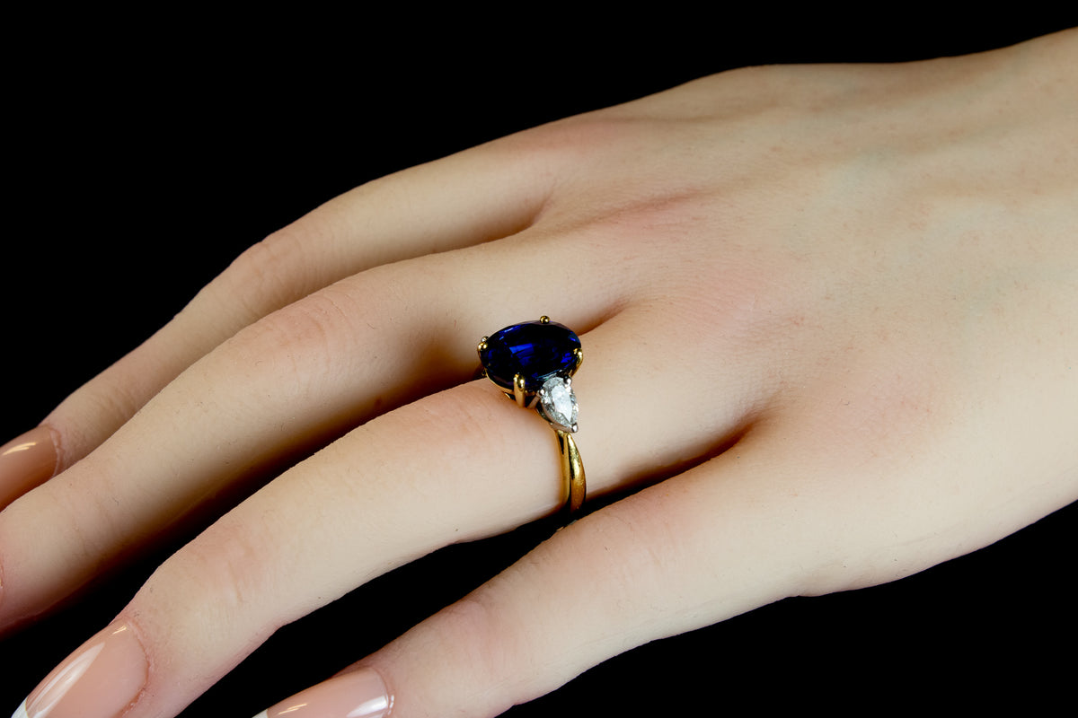 An Impressive 18ct Gold Oval Cut  4.96ct Sapphire And Pear Cut Diamond Three Stone Ring