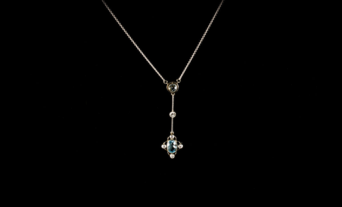 1930s Platinum and 18ct Gold Aquamarine and Diamond Drop Pendant