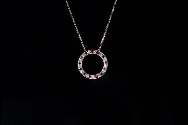 18ct gold ruby and diamond circle pendant