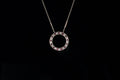 18ct gold ruby and diamond circle pendant