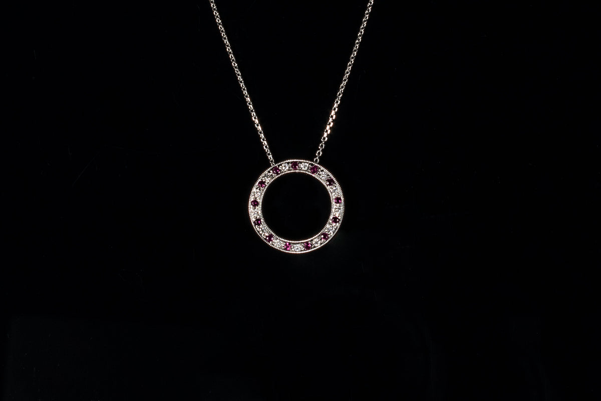 18ct gold ruby and diamond circle pendant