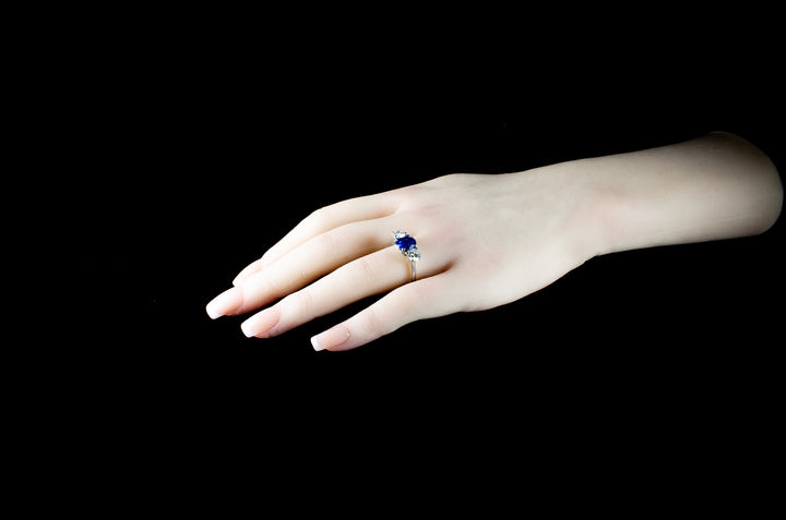 Platinum Mounted Three Stone Diamond and 3.04ct Sapphire Ring
