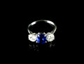 Platinum Mounted Three Stone Diamond and 3.04ct Sapphire Ring