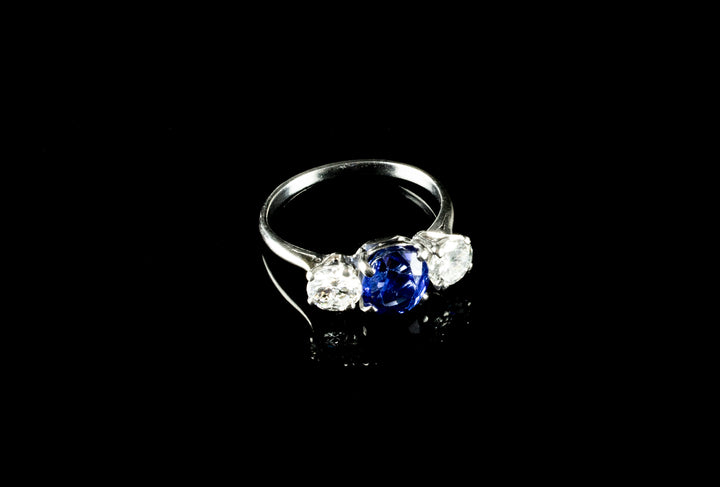 Platinum Mounted Three Stone Diamond and 3.04ct Sapphire Ring
