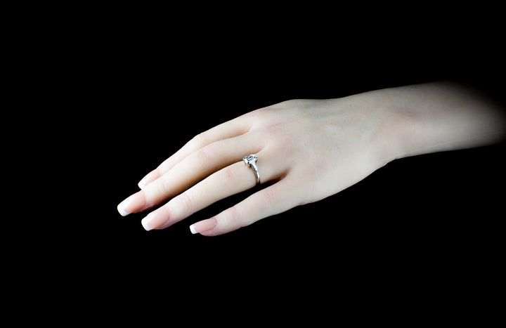 Platinum Emerald cut Diamond Ring with two Tapered Baguette Diamonds