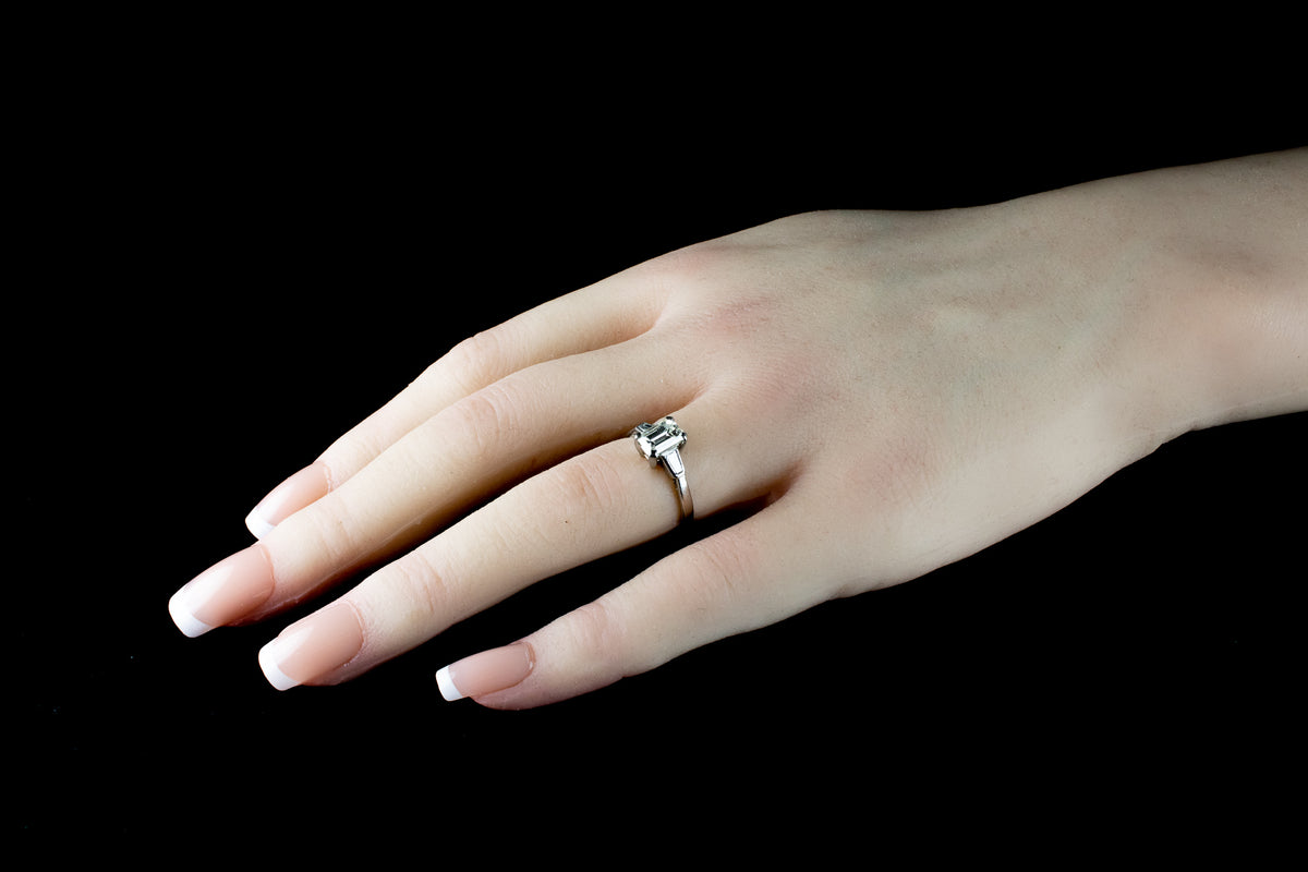Platinum Emerald cut Diamond Ring with two Tapered Baguette Diamonds