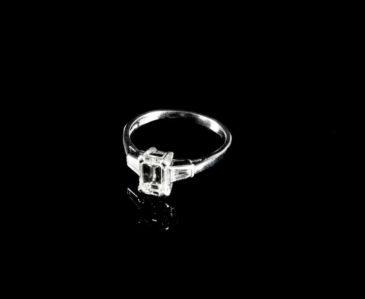 Platinum Emerald cut Diamond Ring with two Tapered Baguette Diamonds