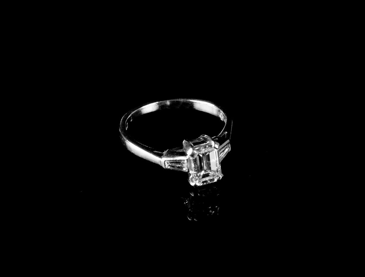 Platinum Emerald cut Diamond Ring with two Tapered Baguette Diamonds