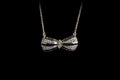 18ct White Gold Sapphire and Diamond set Bow Pendant, London 1990