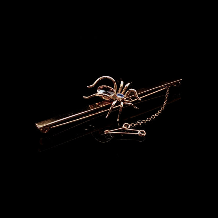 Art Deco 9ct Gold Spider Bar Brooch with Brown Zircon and Sapphire by Saunders & Shepherd, Circa 1930