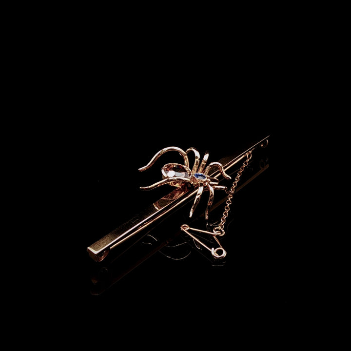Art Deco 9ct Gold Spider Bar Brooch with Brown Zircon and Sapphire by Saunders & Shepherd, Circa 1930