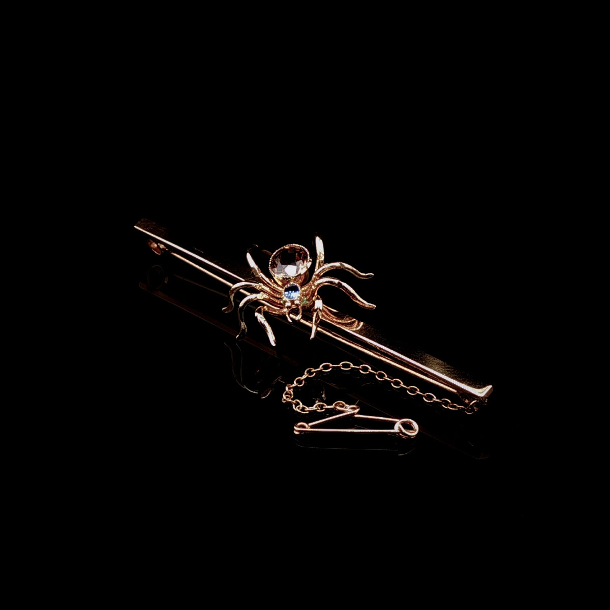 Art Deco 9ct Gold Spider Bar Brooch with Brown Zircon and Sapphire by Saunders & Shepherd, Circa 1930