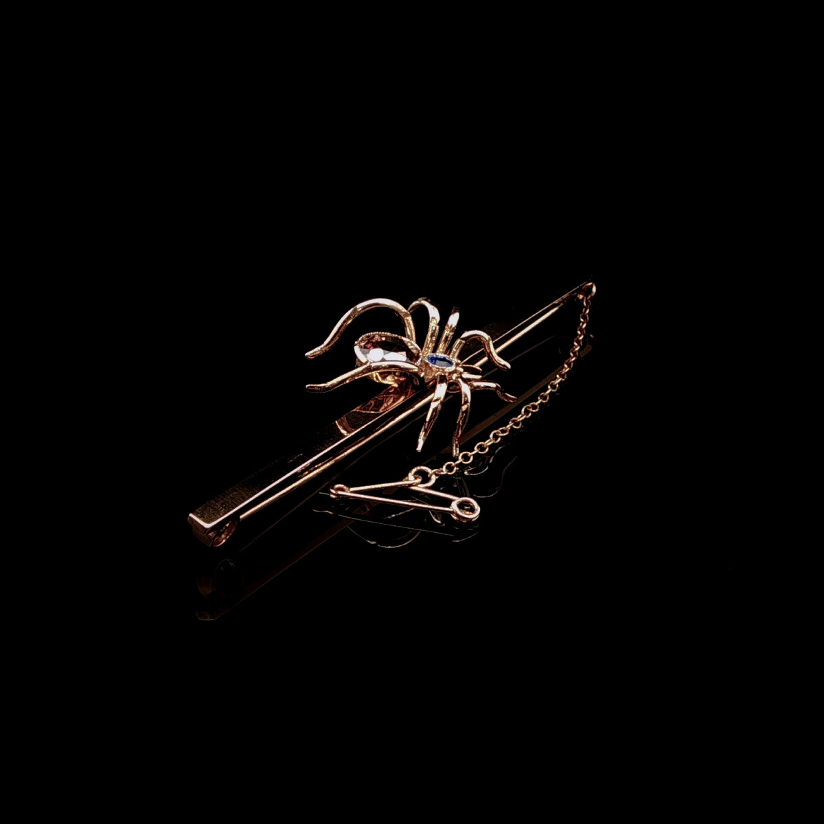 Art Deco 9ct Gold Spider Bar Brooch with Brown Zircon and Sapphire by Saunders & Shepherd, Circa 1930
