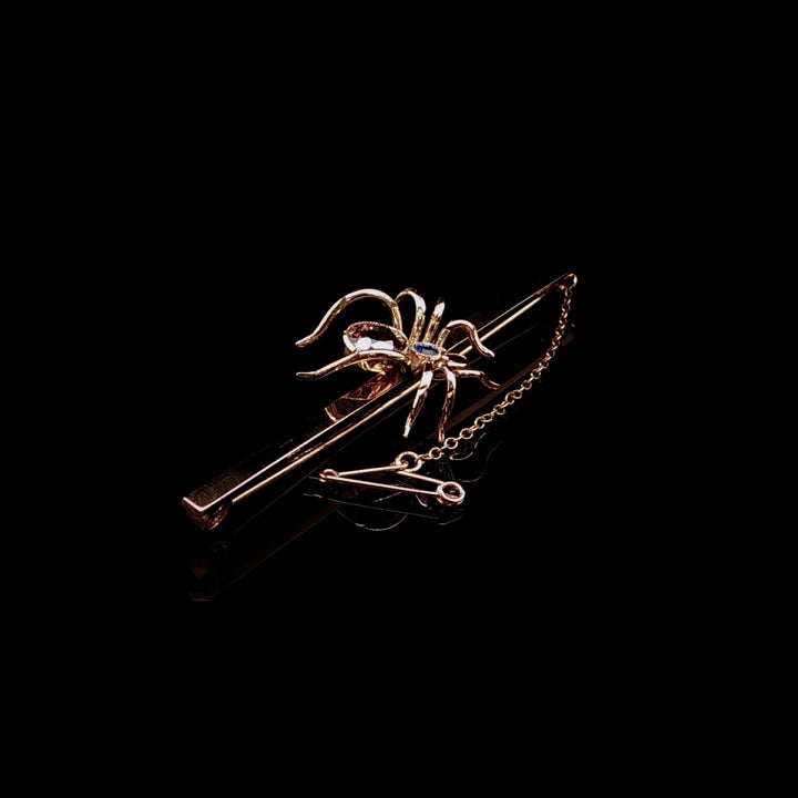 Art Deco 9ct Gold Spider Bar Brooch with Brown Zircon and Sapphire by Saunders & Shepherd, Circa 1930