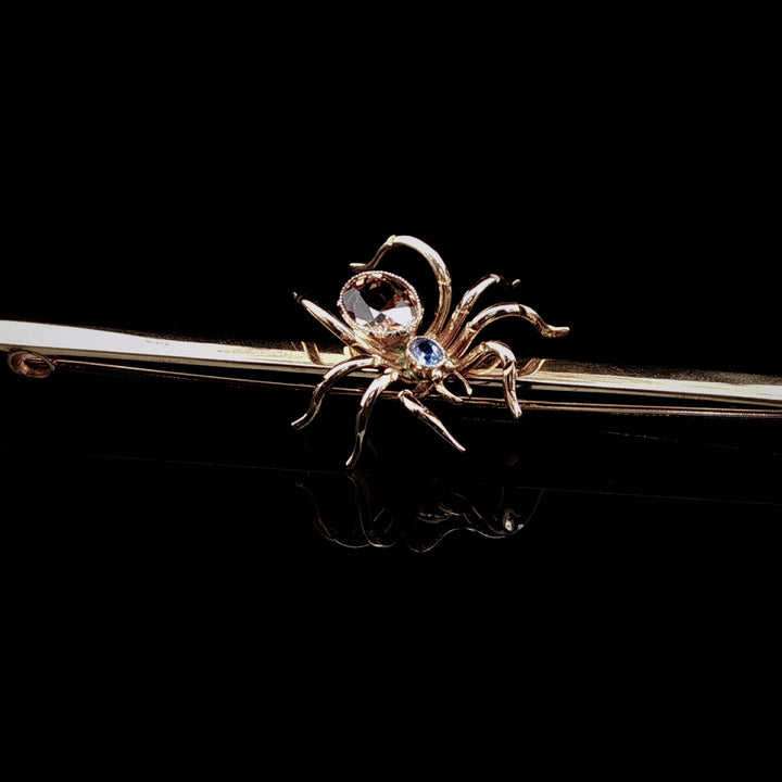 Art Deco 9ct Gold Spider Bar Brooch with Brown Zircon and Sapphire by Saunders & Shepherd, Circa 1930