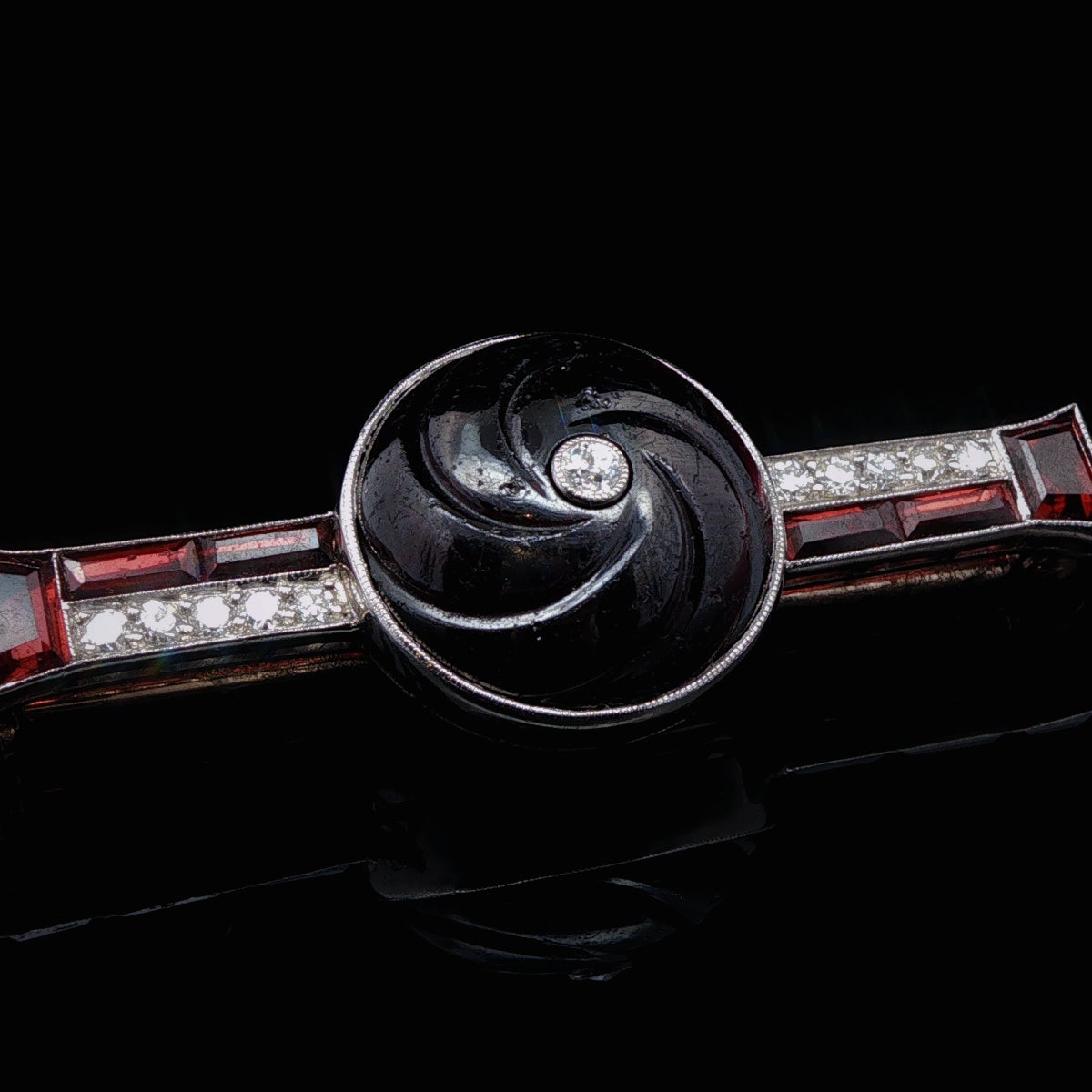 Art Deco Carved Garnet, Old Cut Diamond and Platinum Brooch, Circa 1935