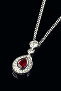 18ct White Gold Pear-Cut Ruby Drop Pendant with a Diamond Halo