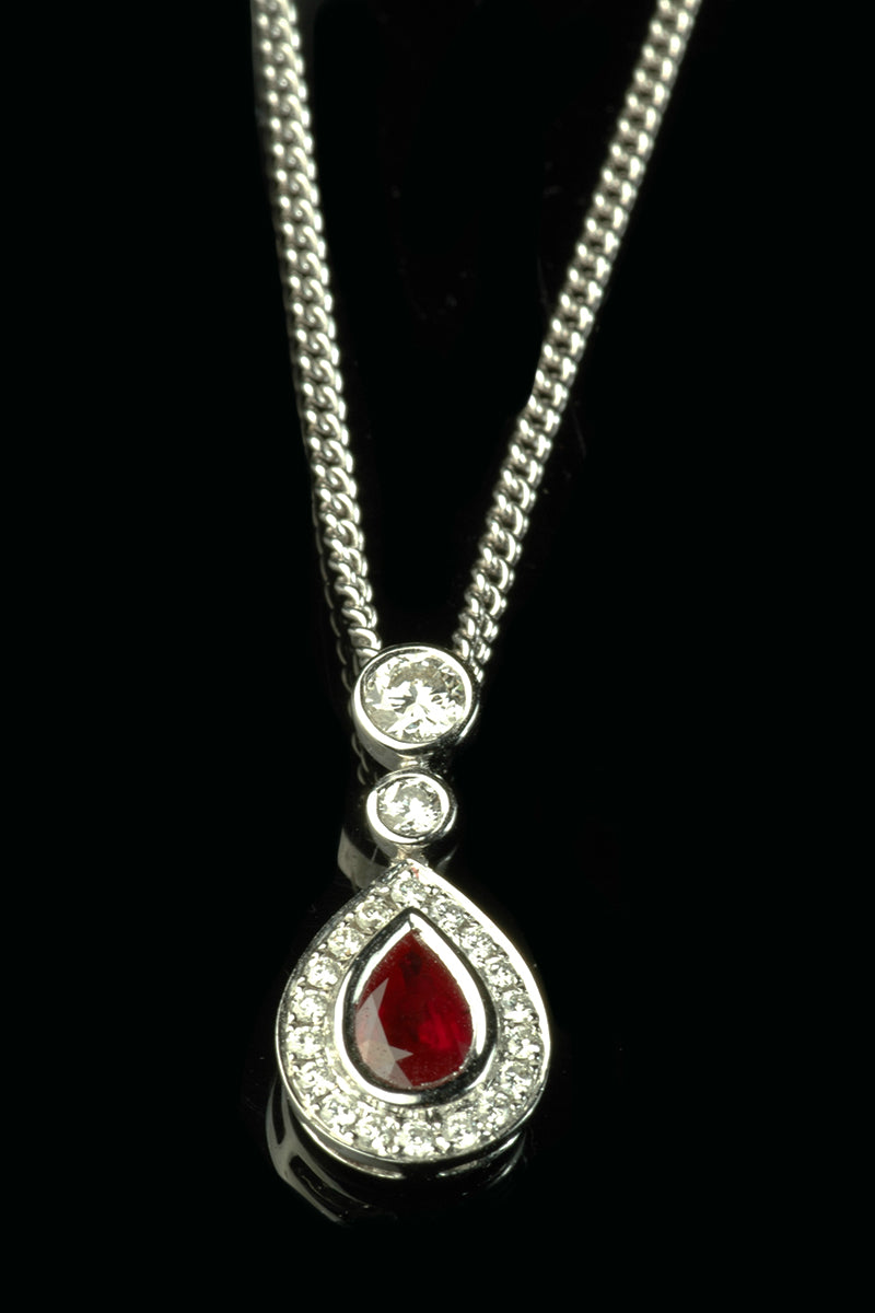 18ct White Gold Pear-Cut Ruby Drop Pendant with a Diamond Halo